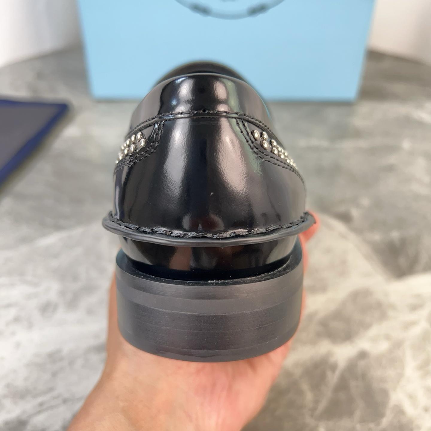 Prada Studded Brushed Leather Loafers - DesignerGu