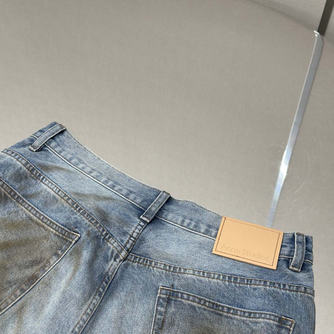 Acne Studios Mud-dyed torn jeans - DesignerGu