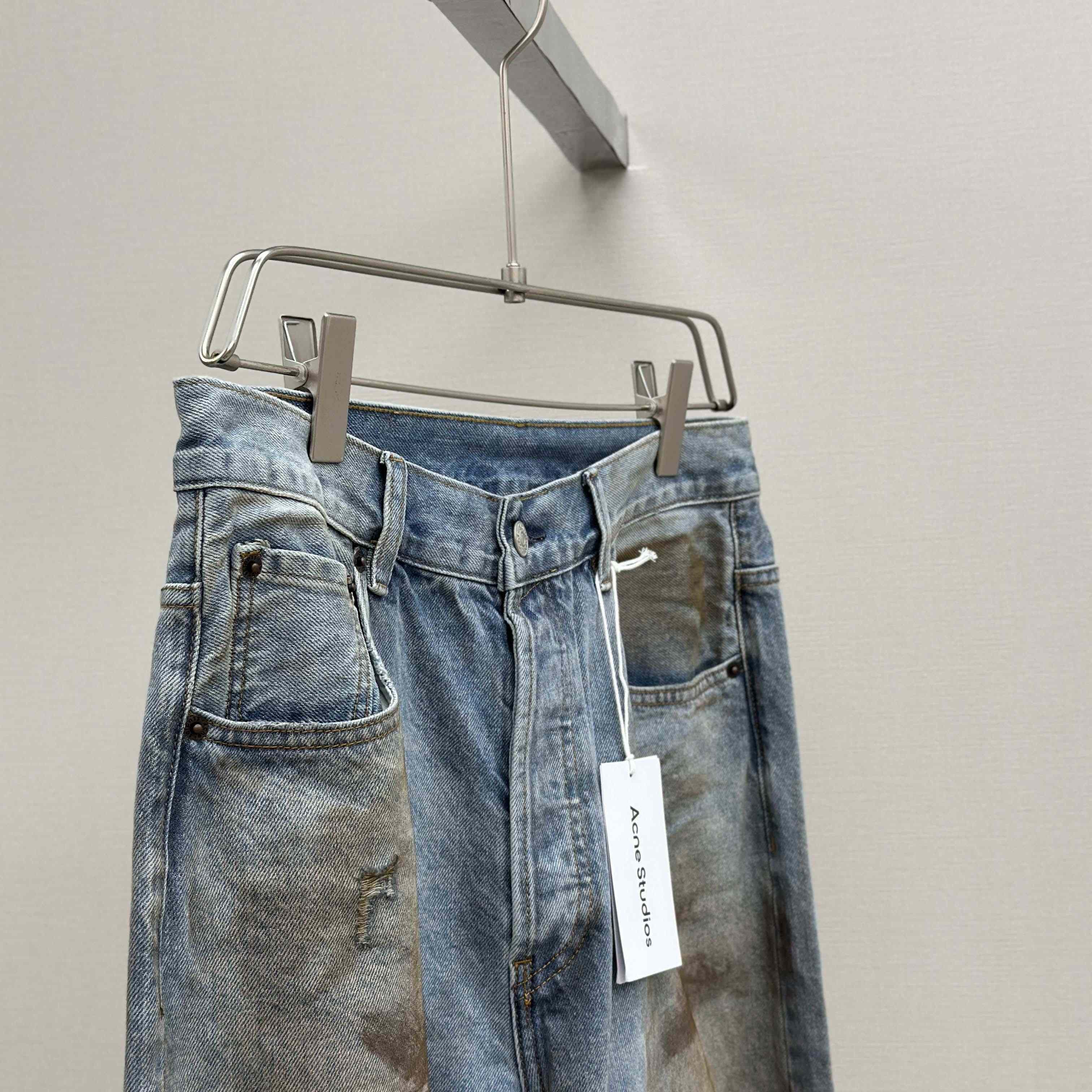 Acne Studios Mud-dyed torn jeans - DesignerGu