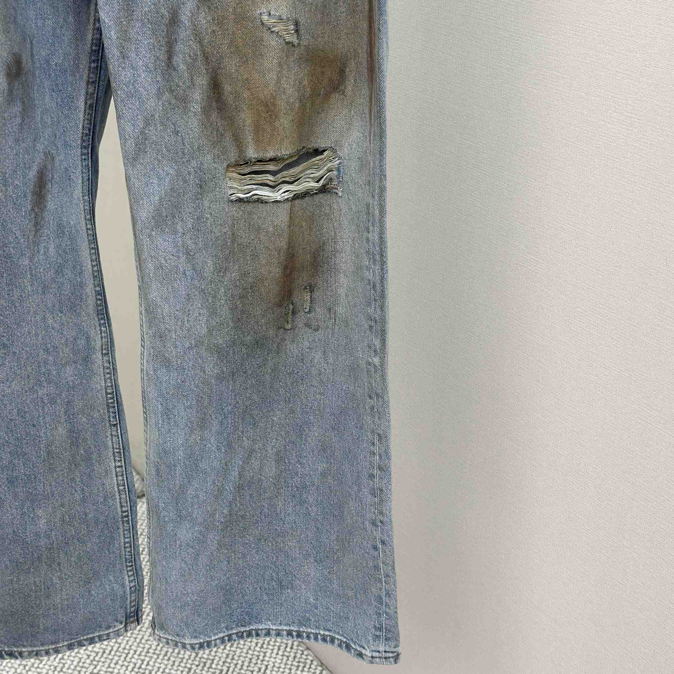Acne Studios Mud-dyed torn jeans - DesignerGu