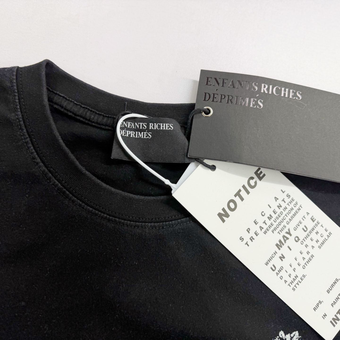 Enfants Riches Déprimés Un Secret Printed Cotton T-shirt - DesignerGu