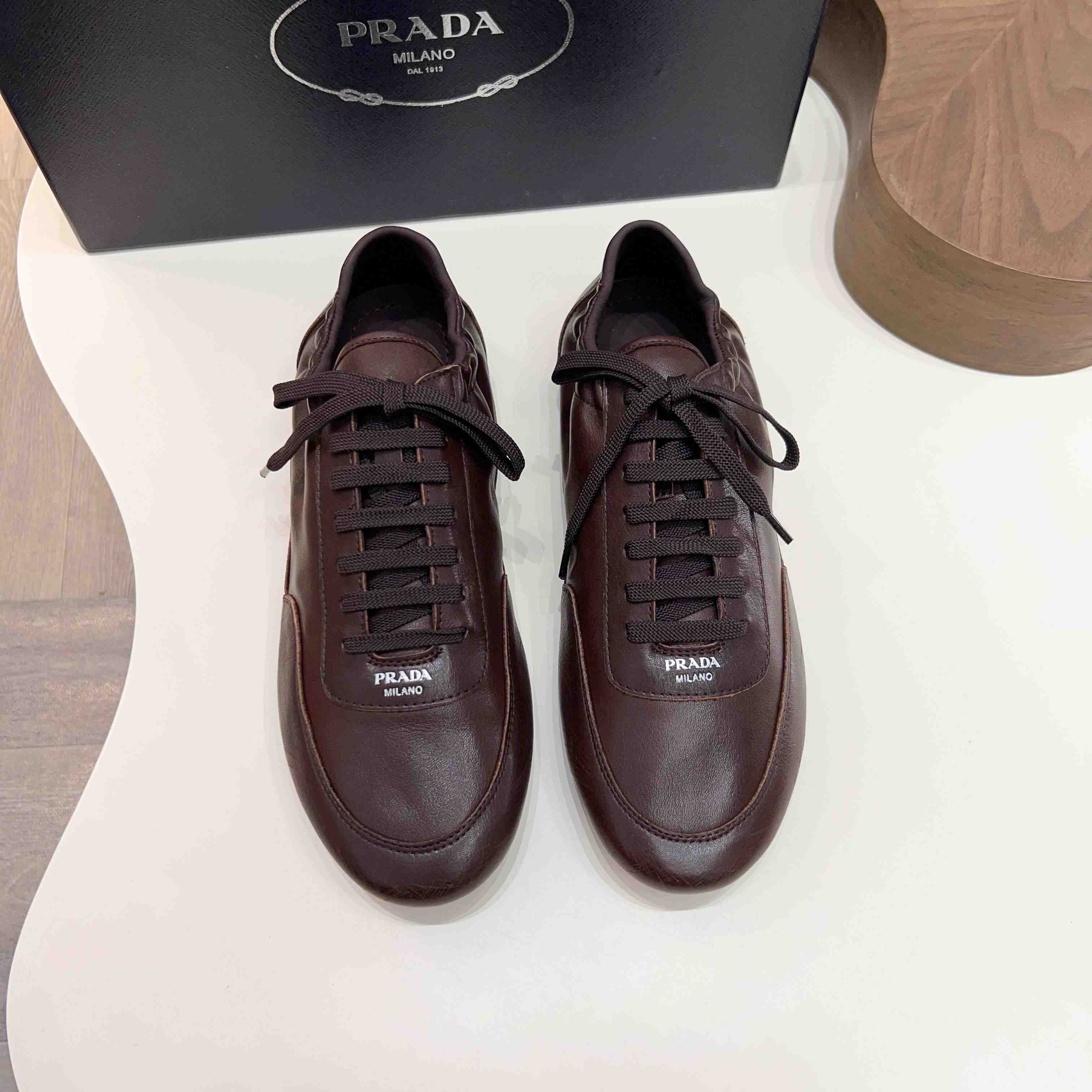 Prada Collapse Leather Sneakers - DesignerGu