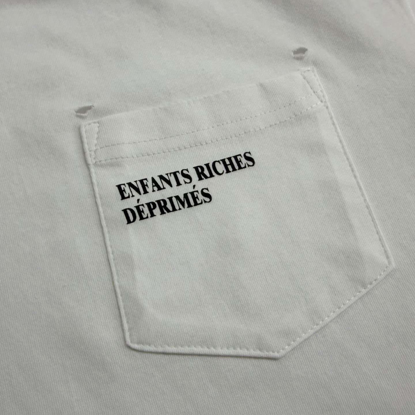 Enfants Riches Déprimés  Distressed Logo-Print Cotton-Jersey T-Shirt - White - DesignerGu