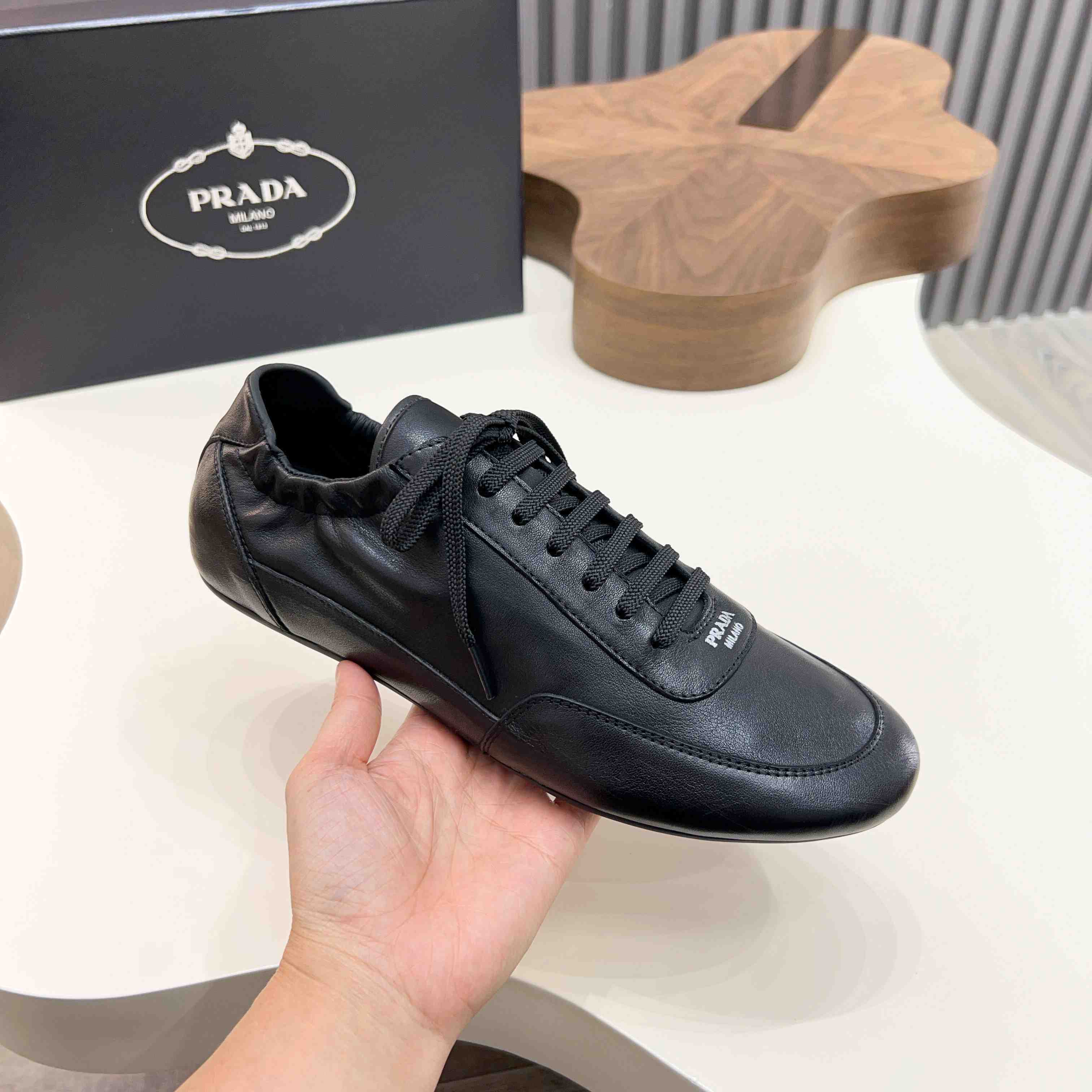 Prada Collapse Leather Sneakers - DesignerGu